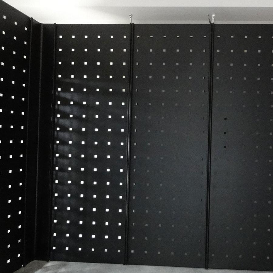 Black metal panels for freestanding or wall display in multiple configurations.