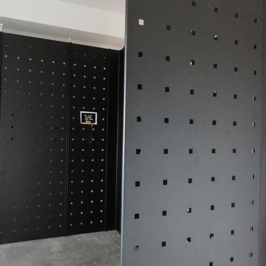 Black metal panels for freestanding or wall display in multiple configurations.