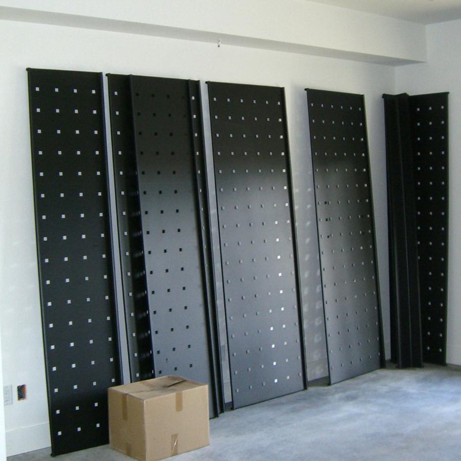 Black metal panels for freestanding or wall display in multiple configurations.