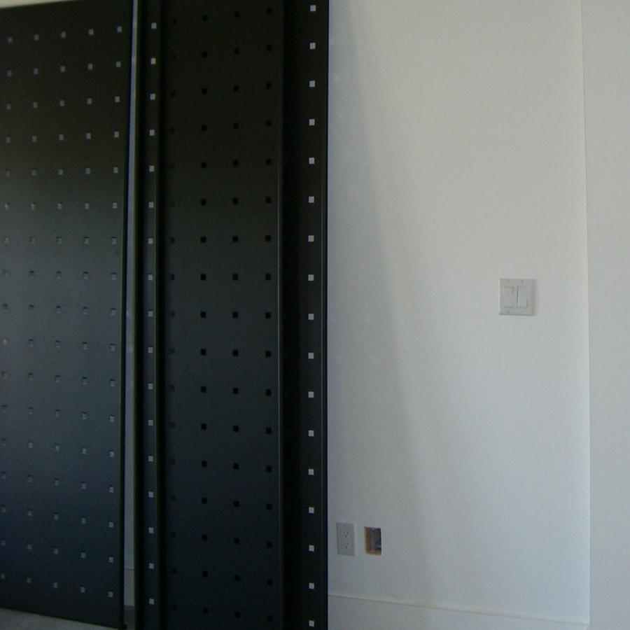 Black metal panels for freestanding or wall display in multiple configurations.