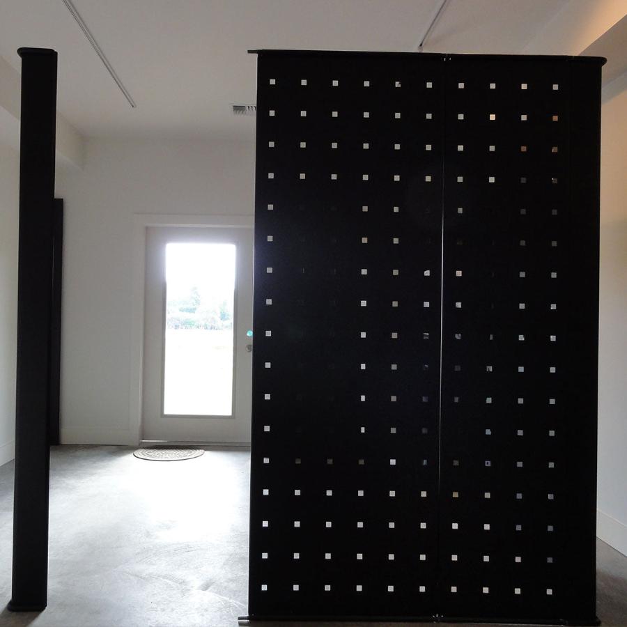 Black metal panels for freestanding or wall display in multiple configurations.