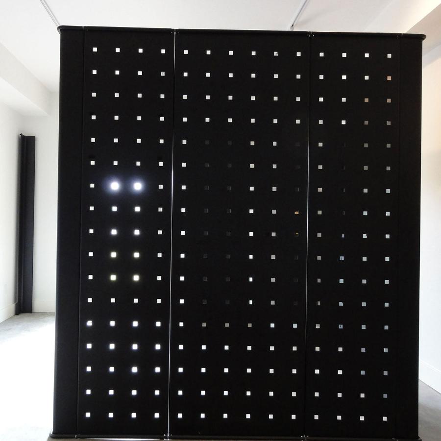 Black metal panels for freestanding or wall display in multiple configurations.